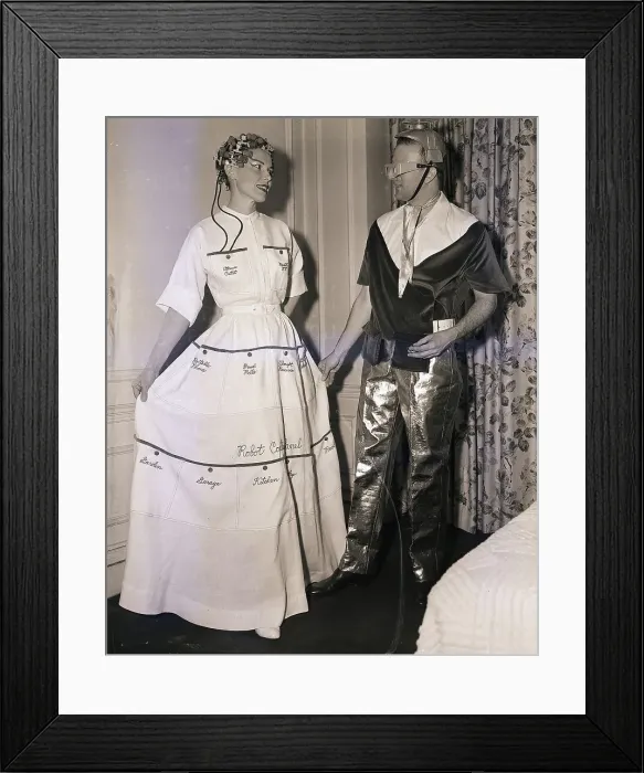 Framed Print : Woman in Forty Pocket Dress with Man in Atomic Suit Framed Print : Woman in Forty Pocket Dress with Man in Atomic Suit