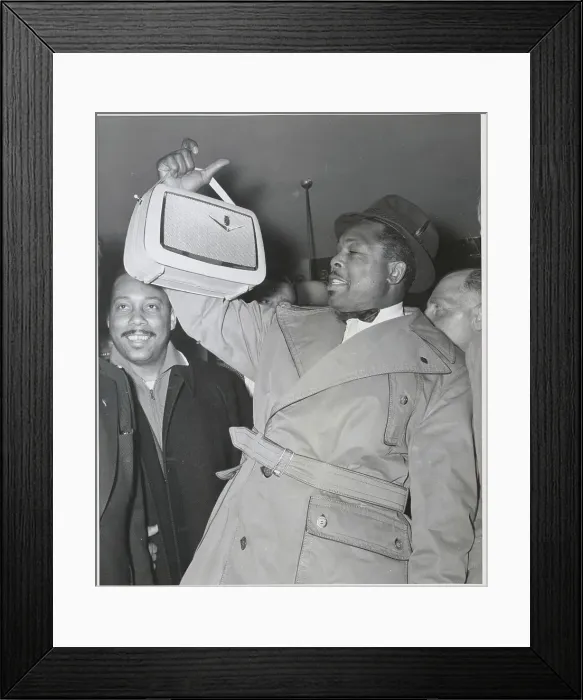 Framed Print : Archie Moore Holding Radio Framed Print : Archie Moore Holding Radio