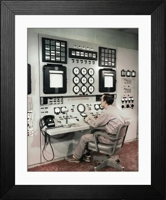 Framed Print : Man Sitting at Control Panel of Nuclear Reactor Framed Print : Man Sitting at Control Panel of Nuclear Reactor