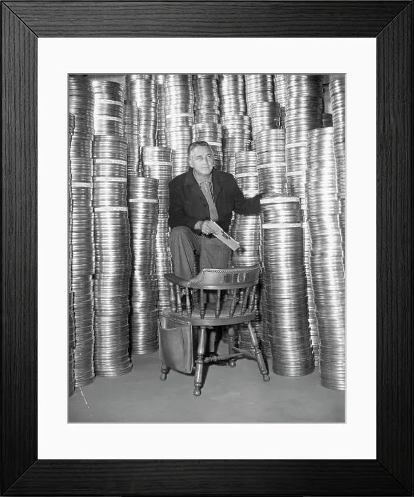 Framed Print : Mervyn LeRoy Posing with Film Reels Framed Print : Mervyn LeRoy Posing with Film Reels