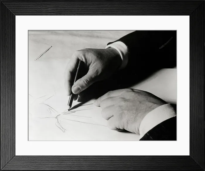 Framed Print : Christian Dior Sketching a Dress