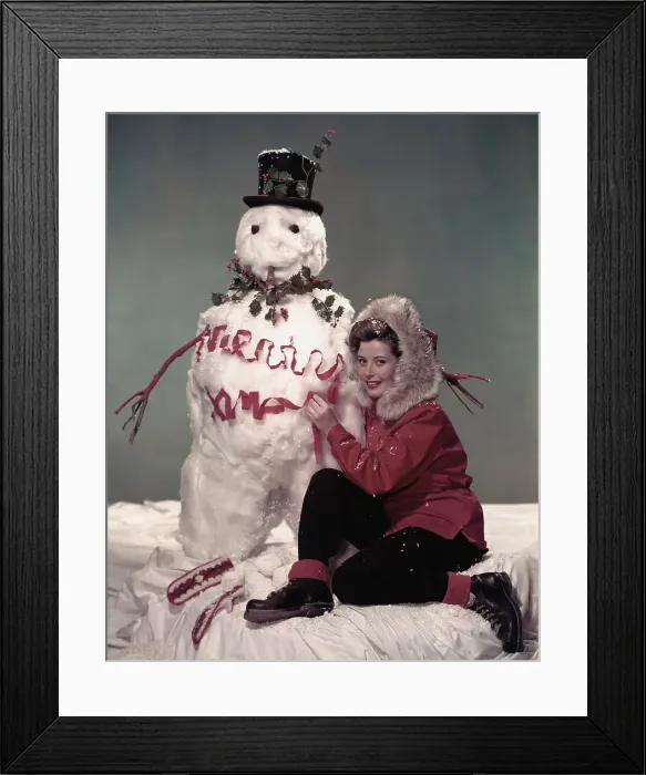 Framed Print : Actress Gloria De Haven with Snowman