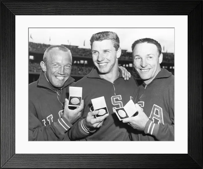 Framed Print : U.S. Discus Throwers Hold Olympic Medals Framed Print : U.S. Discus Throwers Hold Olympic Medals