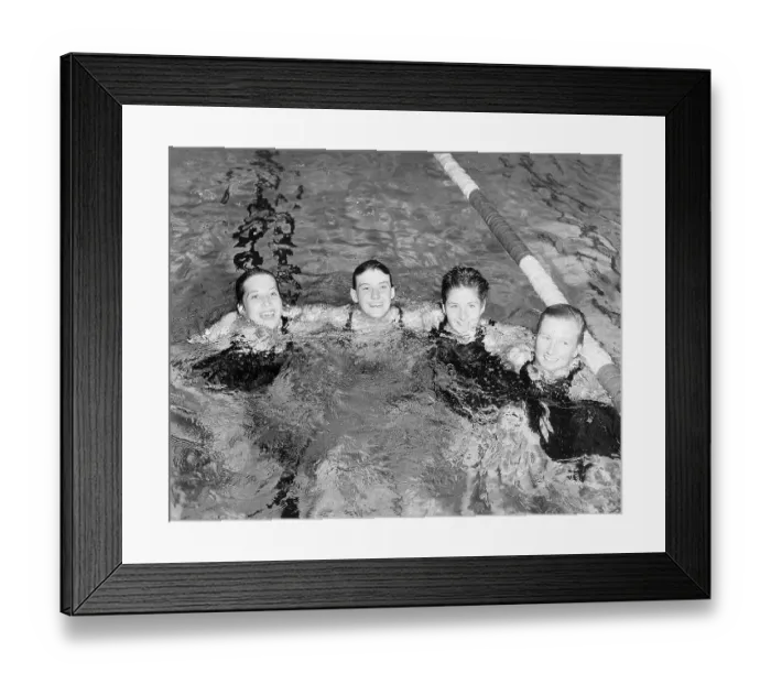 Framed Print : Women's Swimming Relay Team in Pool Framed Print : Women's Swimming Relay Team in Pool