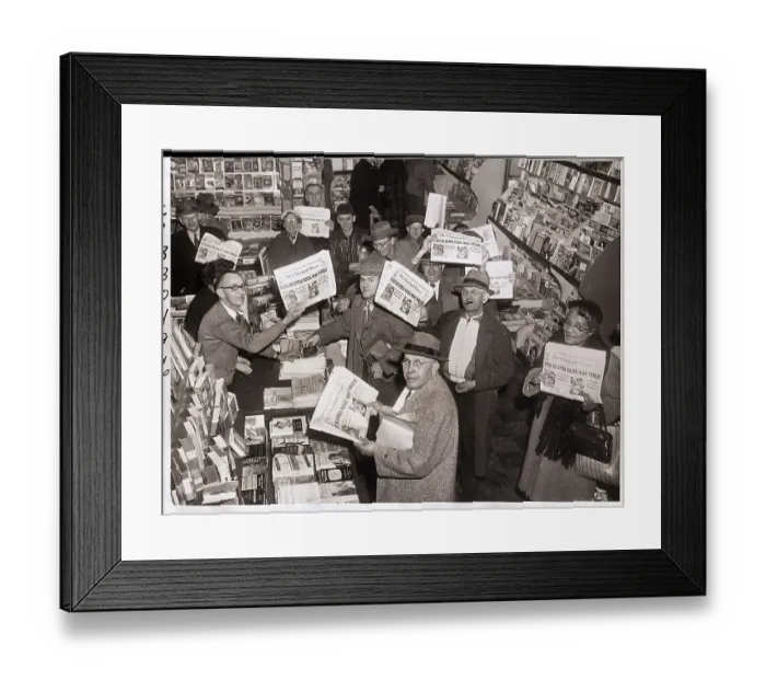 Framed Print : Readers Hold Up Newspapers in Bookstore Framed Print : Readers Hold Up Newspapers in Bookstore