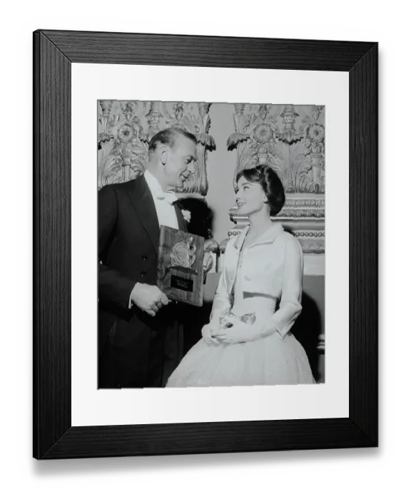Framed Print : Gary Cooper Showing His Award to Audrey Hepburn Framed Print : Gary Cooper Showing His Award to Audrey Hepburn
