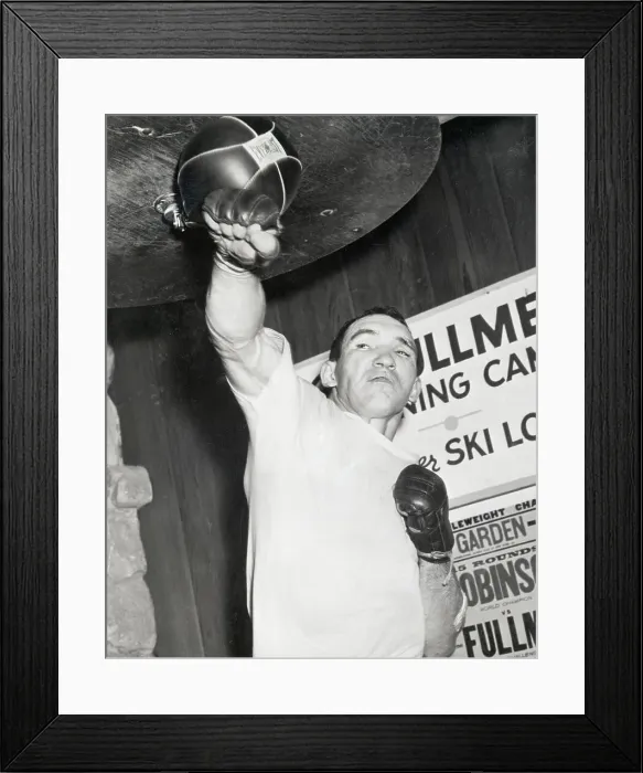Framed Print : Below Gene Fullmer Punching Bag Squinting