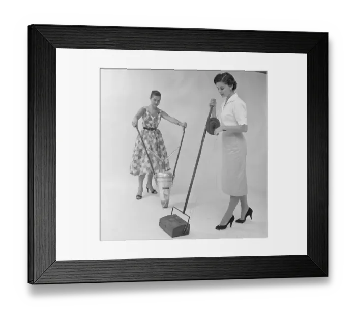 Framed Print : Women Demonstrate Old Vacuum Cleaners Framed Print : Women Demonstrate Old Vacuum Cleaners