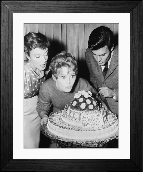 Framed Print : Brigitte Bardot Blowing out Birthday Candles Framed Print : Brigitte Bardot Blowing out Birthday Candles