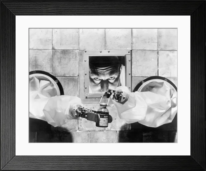 Framed Print : Scientist Bottling Radioactive Isotopes Framed Print : Scientist Bottling Radioactive Isotopes