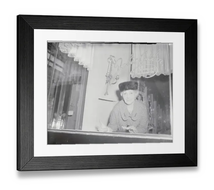 Framed Print : Woman Looking Through Store Window Framed Print : Woman Looking Through Store Window