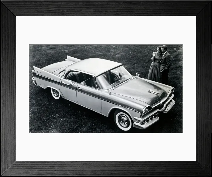 Framed Print : 1957 Dodge Lancer 4-Door with Couple Standing