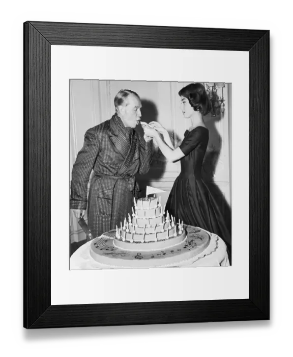 Framed Print : Audrey Hepburn Feeding Maurice Chevalier Birthday Cake Framed Print : Audrey Hepburn Feeding Maurice Chevalier Birthday Cake