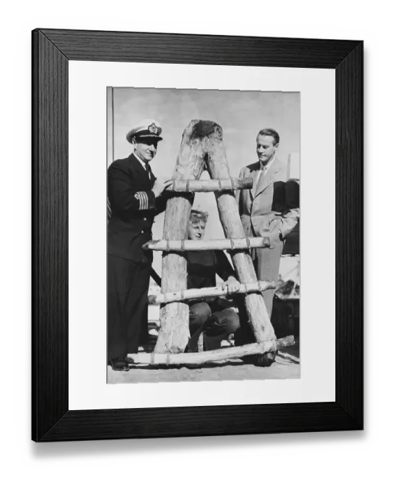 Framed Print : Thor Heyerdahl with Son Posing with Wooden Sledge Framed Print : Thor Heyerdahl with Son Posing with Wooden Sledge