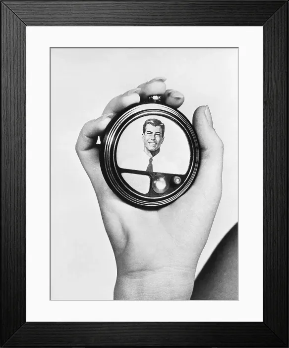 Framed Print : Hand Holding a Model for a Video Telephone Framed Print : Hand Holding a Model for a Video Telephone