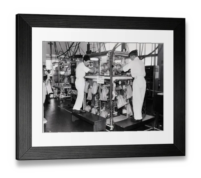 Framed Print : Men W / Arms In Machine Holes Handle Urani Framed Print : Men W / Arms In Machine Holes Handle Urani
