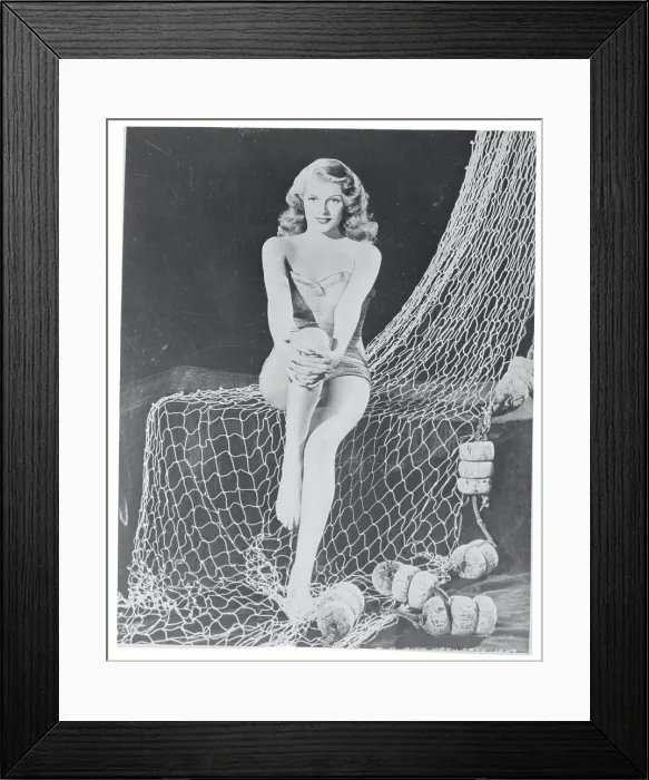 Framed Print : Rita Hayworth Sitting on Fishnet Framed Print : Rita Hayworth Sitting on Fishnet