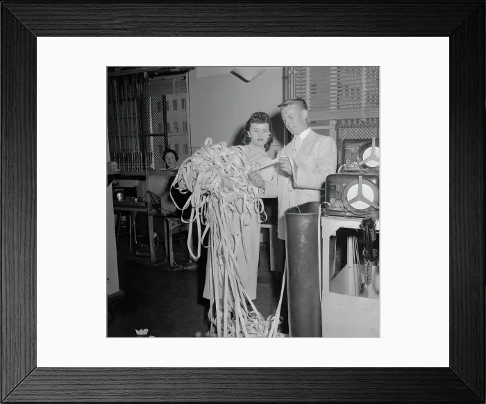 Framed Print : Woman Holding Ticker Tape
