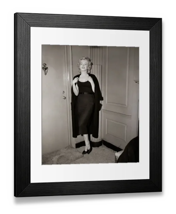 Framed Print : Marilyn Monroe Holding Sweater By Door Framed Print : Marilyn Monroe Holding Sweater By Door
