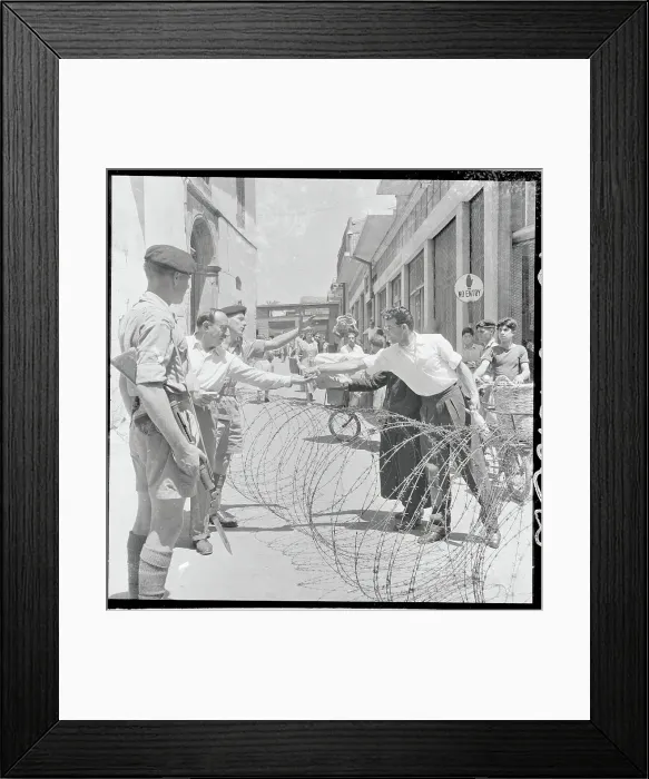 Framed Print : View of Soldiers Near Barbed Wire Barricade Framed Print : View of Soldiers Near Barbed Wire Barricade