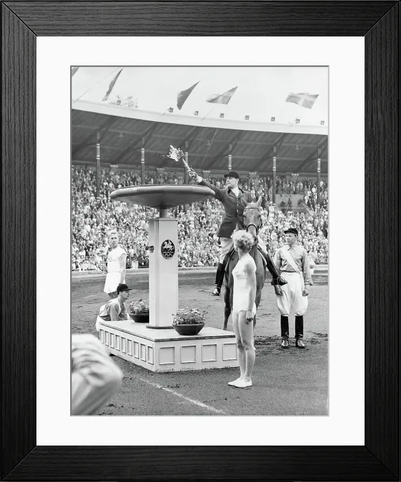 Framed Print : Man Applying Torch to Olympic Flame Framed Print : Man Applying Torch to Olympic Flame