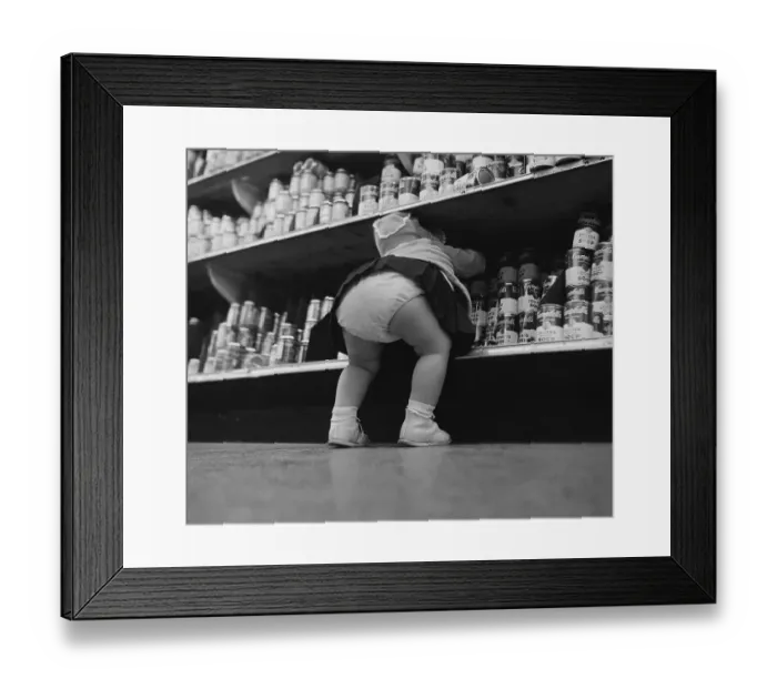 Framed Print : Child Grabbing Cans from Shelf at Supermarket Framed Print : Child Grabbing Cans from Shelf at Supermarket