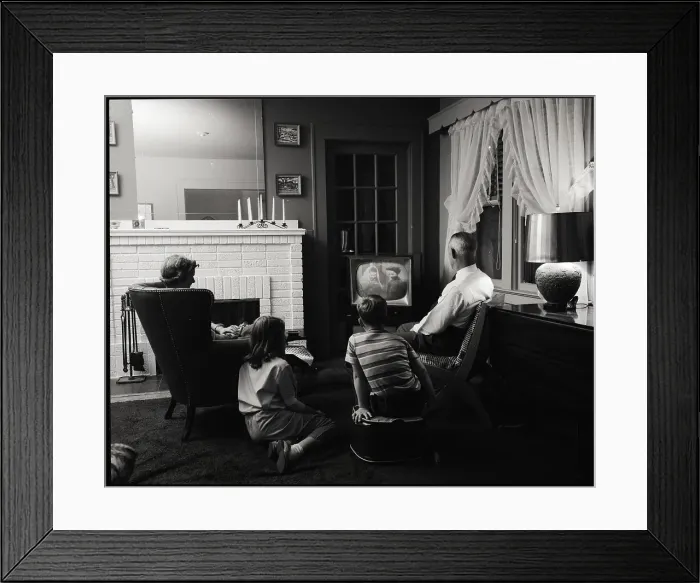 Framed Print : Family Watching Television in Living Room Framed Print : Family Watching Television in Living Room
