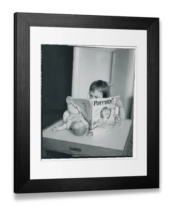 Framed Print : Girl Reading Parents Magazine