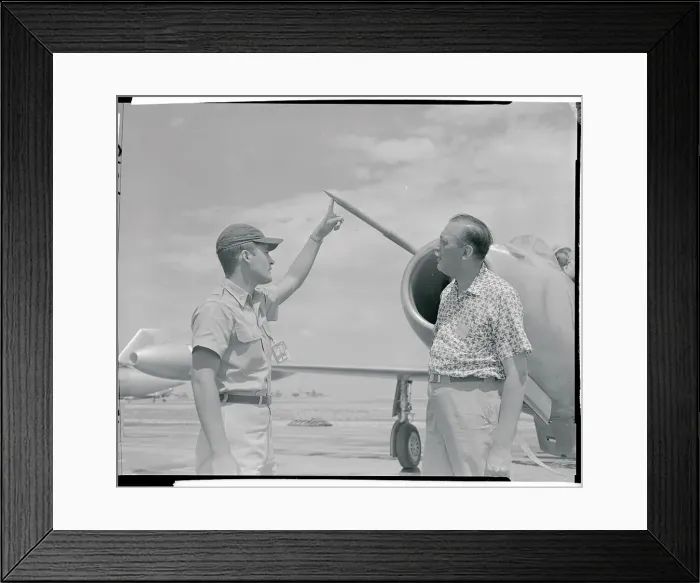 Framed Print : Officer Pointing to a Needle on a Jet Plane Framed Print : Officer Pointing to a Needle on a Jet Plane
