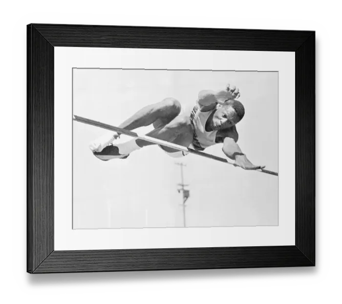 Framed Print : Bill Russell Jumping Over a High Bar Framed Print : Bill Russell Jumping Over a High Bar