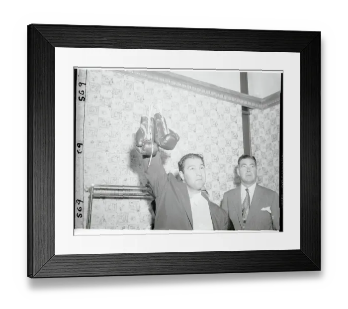 Framed Print : Rocky Marciano Holding Up His Boxing Gloves Framed Print : Rocky Marciano Holding Up His Boxing Gloves