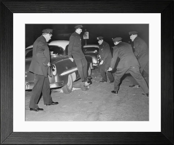 Framed Print : Steven Montenez Lying Under Car with Policeman's Foot on His Neck Framed Print : Steven Montenez Lying Under Car with Policeman's Foot on His Neck