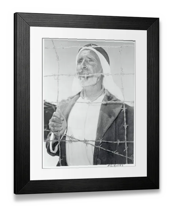 Framed Print : Arab Man Behind a Barbed Wire on Gaza Strip Framed Print : Arab Man Behind a Barbed Wire on Gaza Strip