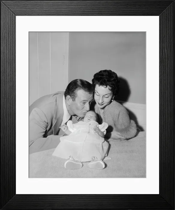 Framed Print : Actor John Wayne with His Wife and Newborn Framed Print : Actor John Wayne with His Wife and Newborn