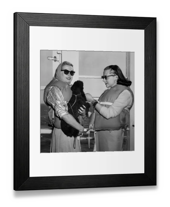Framed Print : Grace Kelly Holding a Poodle Framed Print : Grace Kelly Holding a Poodle