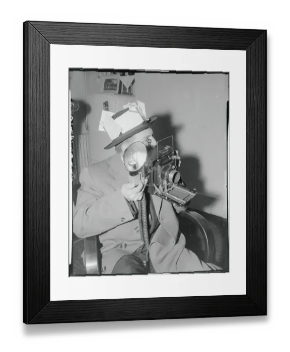 Framed Print : News Photographer Holding His Camera