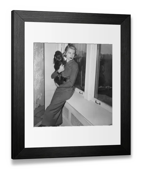 Framed Print : Grace Kelly and Poodle Posing by Window Framed Print : Grace Kelly and Poodle Posing by Window