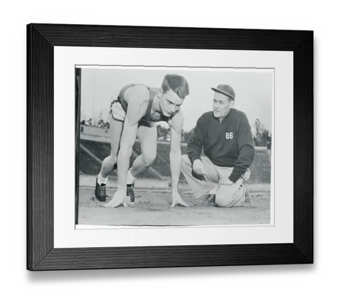 Framed Print : Dave Sime Reaching Instructions From His Coach Framed Print : Dave Sime Reaching Instructions From His Coach