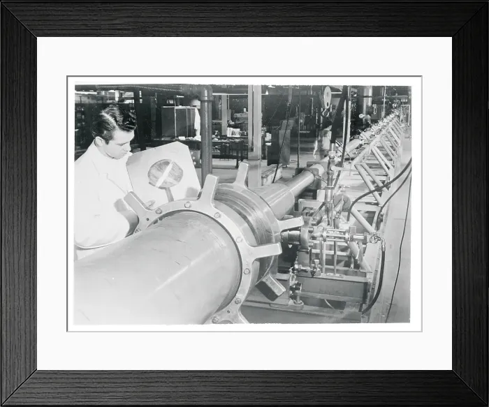 Framed Print : Technician Placing a Steel Diaphragm on a Shock Tube Framed Print : Technician Placing a Steel Diaphragm on a Shock Tube