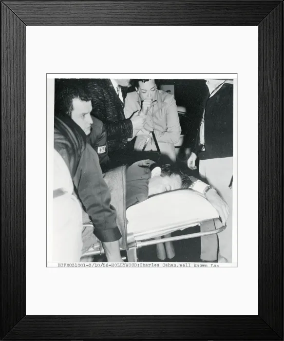 Framed Print : Shooting victim Being Moved to Hospital