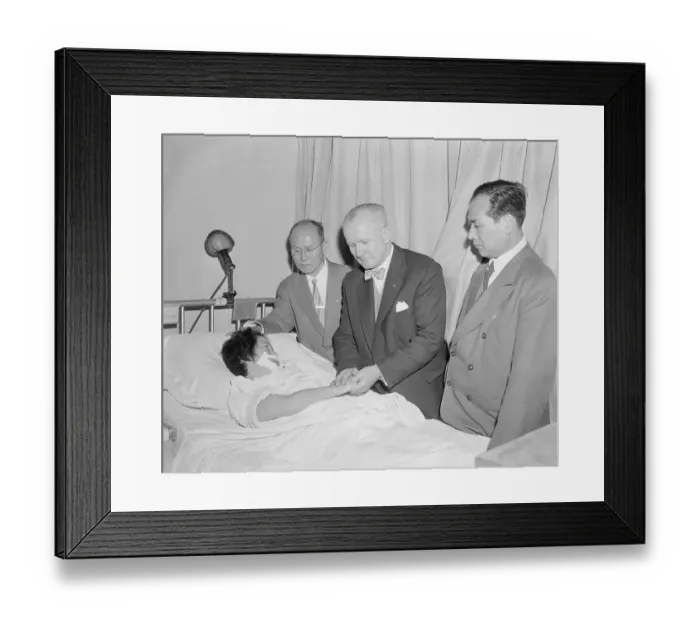 Framed Print : Doctors Examining a Patient Framed Print : Doctors Examining a Patient