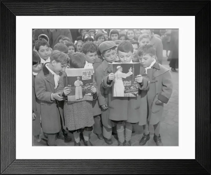 Framed Print : Children Reading Pamphlets Framed Print : Children Reading Pamphlets