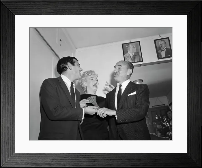 Framed Print : Jack Warner Kisses Marilyn Monroe Framed Print : Jack Warner Kisses Marilyn Monroe