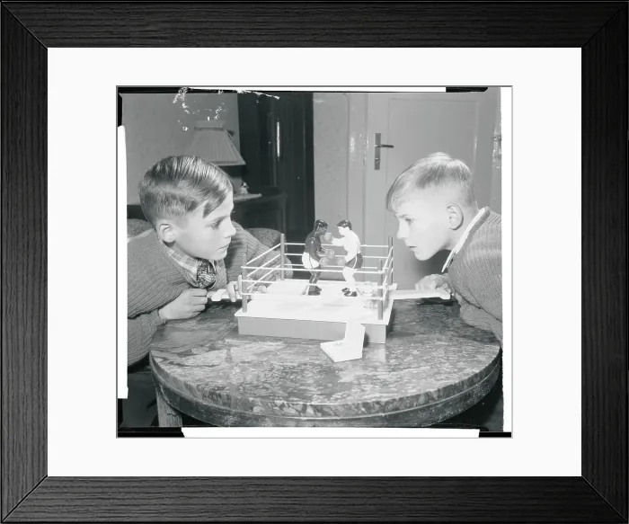 Framed Print : Boys Playing With a Boxing Toy Framed Print : Boys Playing With a Boxing Toy