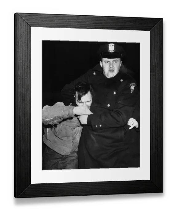 Framed Print : Poliman Holding Striker Head First Framed Print : Poliman Holding Striker Head First