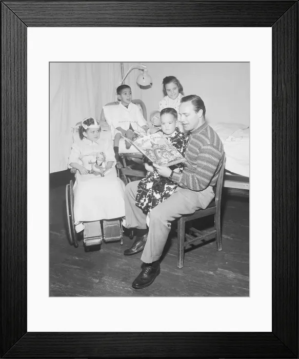 Framed Print : Marlon Brando Reading to Hospitalized Children Framed Print : Marlon Brando Reading to Hospitalized Children