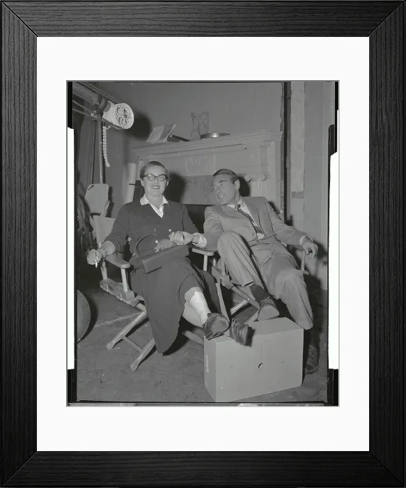 Framed Print : Bette Davis and Husband Relaxing on Lounge Chairs Framed Print : Bette Davis and Husband Relaxing on Lounge Chairs