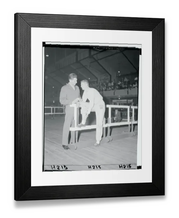 Framed Print : Wes Santee Showing His Leg to Tom Rosandich
