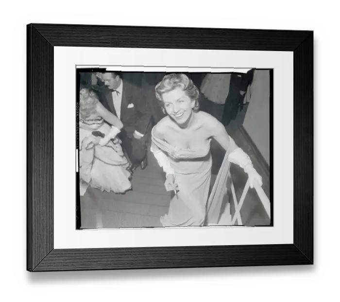Framed Print : Actress Erica Beer Pausing on Staircase Framed Print : Actress Erica Beer Pausing on Staircase