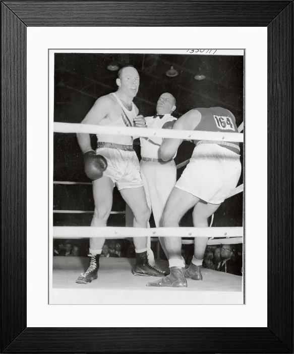 Framed Print : Olympic Boxer T.P. Rademacher Punching Opponent